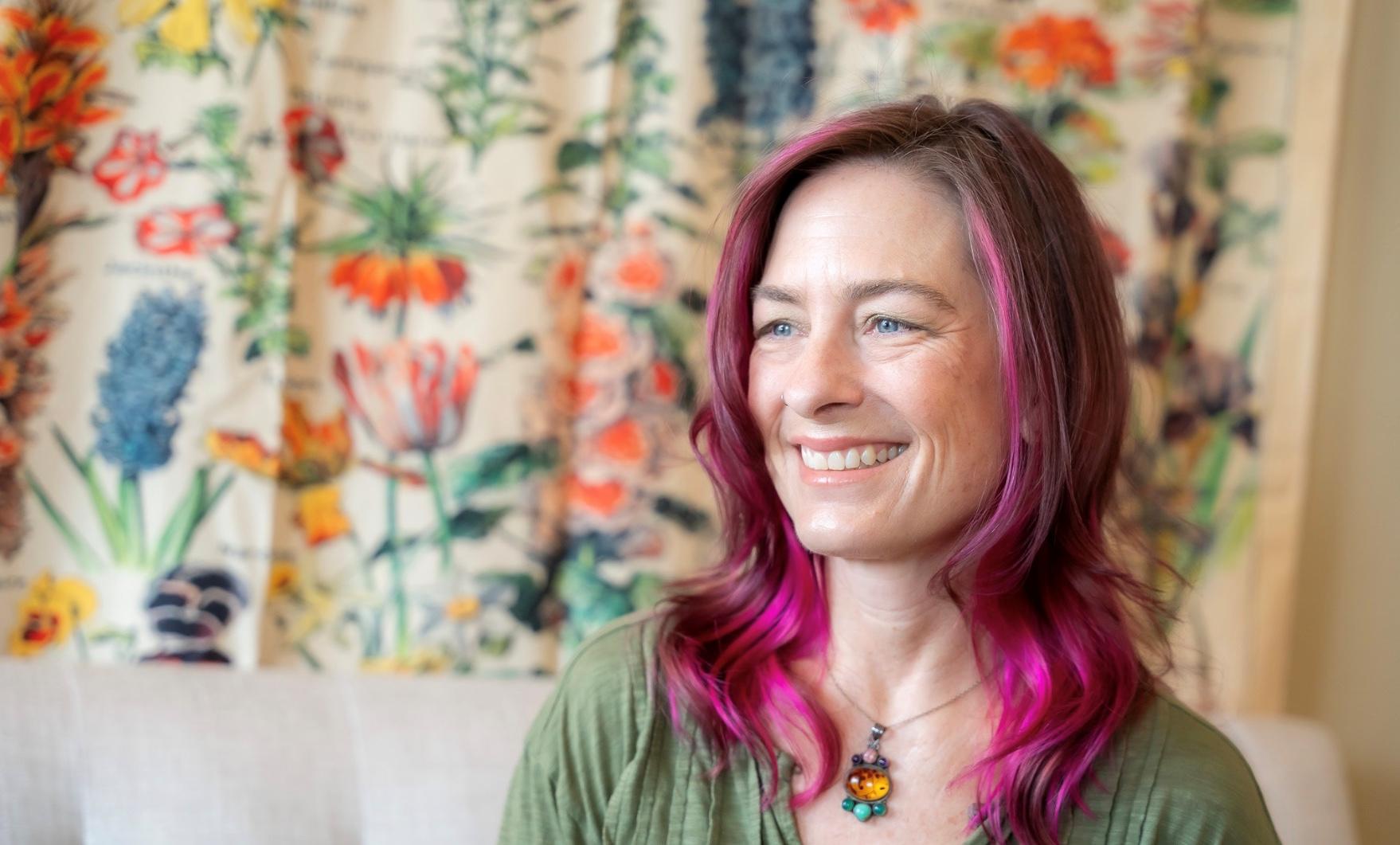 Kitty Ferguson-Mappus smiling in her therapy office at Unbroken Abundance